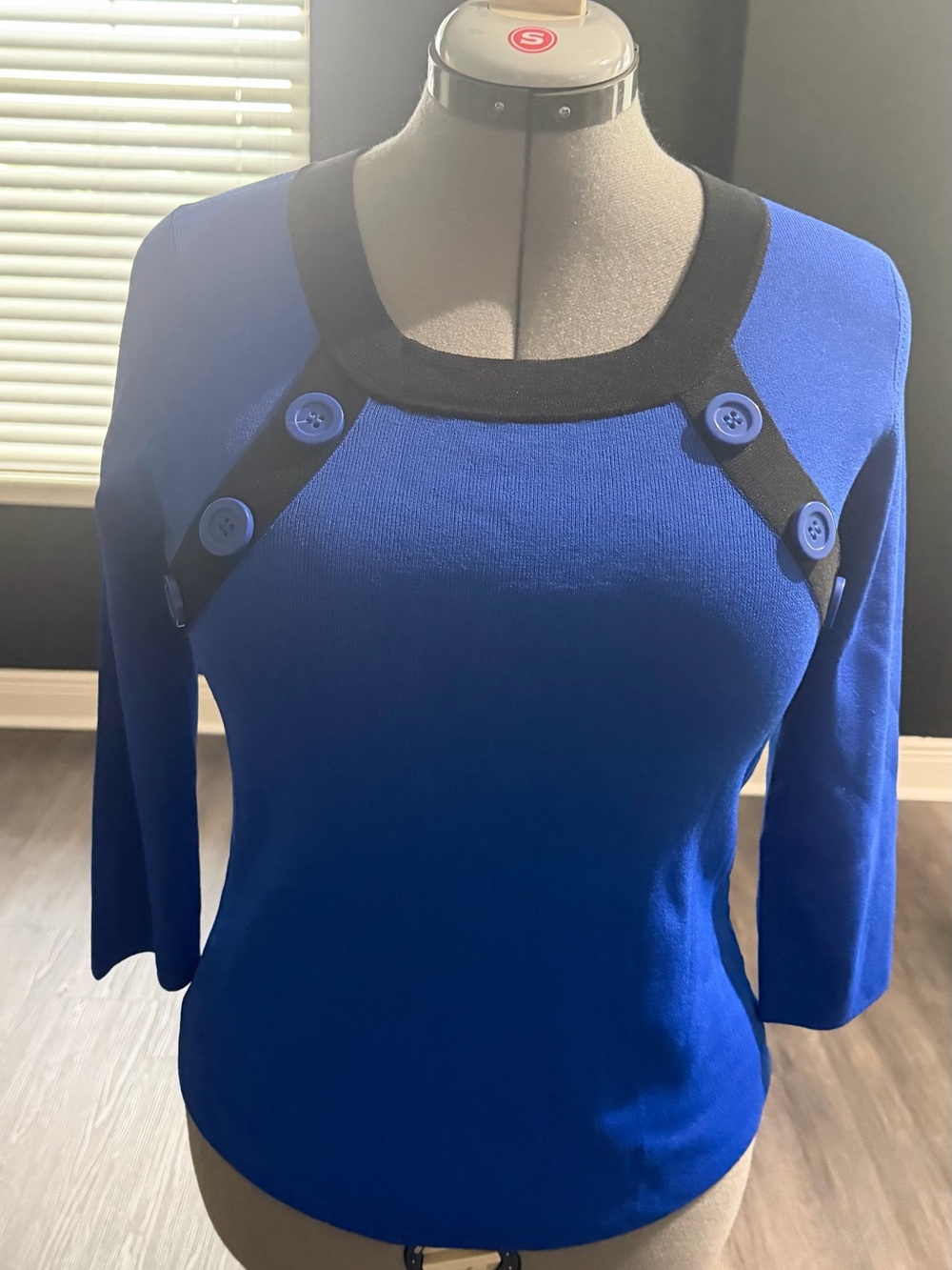 Blue Knit Top with Black Contrast Collar and Button Accents